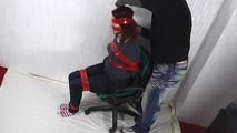 Aurora taped to chair 1/3