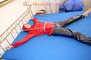 A nice cuty hooded, tied and gagged on bed