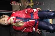 Sexy Sandra wearing sexy red/blue rainwear being tied and gagged with ropes and a clothgag on a chair (Pics)