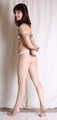 Cleave-gagged topless barefoot Jessica, bound with hemp rope, poses on the floor