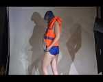 Mara wearing a sexy shiny swimsuit and a shiny nylon shorts trying on a lifevest (Video)