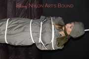Sexy Sandra being tied and gagged overhead with ropes and a clothgag hodded wearing a sexy rainwear combination (Pics)