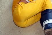 Katharina tied and gagged in a yellow rainsuit