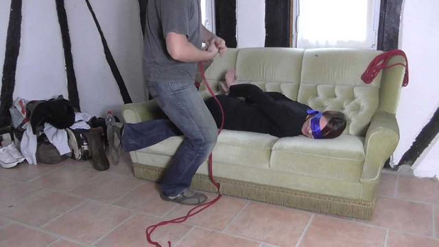 Vanessa hogtie on couch 1/2