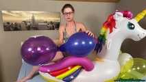 nail2pop promotional balloons on inflatable unicorn and destroying it with a pen