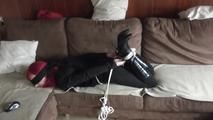 Angi hogtied on couch 2/2