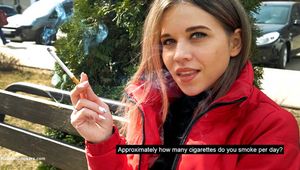 Kate is answering the questions while smoking 120mm in the street