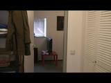 Alina trying on different shiny nylon shorts and rain jackets feeling comfortable on the balcony (Video)