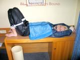Archive girl tied and gagged with tape and rope wearing shiny nylon rainwear in blue (Pics)