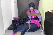 Jill tied and gagged in shiny nylon rainware