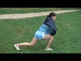 Enni during stretching wearing shiny nylon shorts and an oldschool rain jacket (Video)