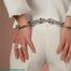 Gina in handcuffs