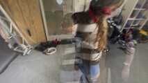 Poor Marie bound and gagged in a shiny nylon Windbreaker