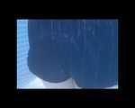 SEXY MARA wearing an oldschool blue shiny nylon shorts and an oldschool shiny nylon rain jacket swimming in the pool (Video)