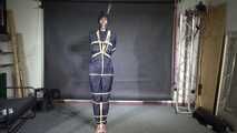 Myxxxy bound and gagged in a shiny nylon Rainsuit