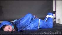 Lucy tied and gagged with ropes on bed wearing sexy blue oldschool downwear (Video)