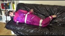 Mara tied and gagged on a sofa wearing sexy pink/purple downwear (Video)