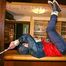 An archive girl tied and gagged on a bar wearing shiny nylon rainwear (Pics)