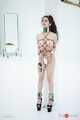Kinbaku waitress in shiny metal