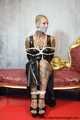 Miss Francine bound and gagged with layers of gags in a sexy PVC dress
