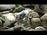 Sophie enjoying the water and weather on a river wearing supersexy grey sauna pvc rainwear (Video)