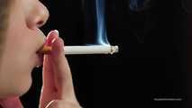 A young lady showing her smoking skills in a closeup video 