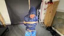 Lena buttplugged, bound and gagged in shiny Shorts and Windbreaker