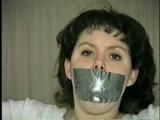 19 Yr OLD JENNIFER IS MOUTH STUFFED, TAPE GAGGED, TIED WITH ARMS OUT AND TO 2 PILLARS & CLEAVE GAGGED (D48-10)d, bondage