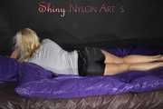 Watching Pia preparing her bed wearing a sexy black shiny nylon shorts and a grey tshirt (Pics)