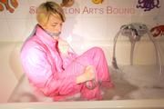 Sonja ties and gagges herself in the bath tub with cuffs wearing sexy shiny nylon downwear (Pics)