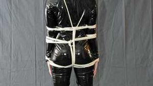 Bound in PVC catsuit