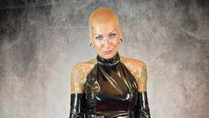 Miss Francine bound and gagged with layers of gags in a sexy PVC dress