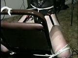 24 YR OLD GERMAN GIRL GRETCHEN IS TIED BACKWARDS ON CHAIR, HANDS TIED BEHIND HER HEAD, CROTCH ROPED, HOME MADE RUBBER BAND BALL-GAGGED & DROOLING (D51-13)