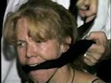 38 Yr OLD CASHIER ATTIC BOUND & GAGGED IN A BLACK LEATHER DRESS (D24-6)