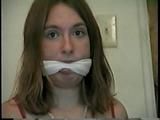24 Yr OLD CRAFTER IS CLEAVE GAGGED, MOUTH STUFFED, HAND GAGGED, OTM GAGGED & TIED TO A CHAIR (D55-6)