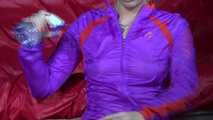 Watching Pia wearing a supersexy shiny nylon shorts and a rain jacket combination experiment with water (Video)