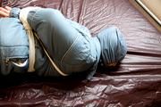 Jill tied and gagged in a shiny nylon oldschool skisuit