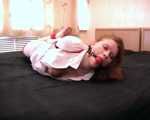 Barefoot nurse Gatitta tied up with a red rope (video)