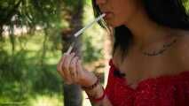 Elizaveta is smoking two all white cigs in a row