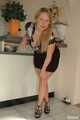 Benita opens her blouse and lifting her skirt in front of the kitchen