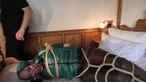 Rachel Adams tied and gagged in shiny Downwear
