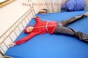 A nice cuty hooded, tied and gagged on bed