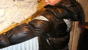 Jill tied and gagged in a black downjacket and rainpants