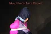Watching Pia wearing blue/pink shiny nylon rainwear being tied and gagged and hooded with tape and a clothgag (Pics)