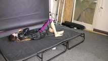 Lana handcuffed and gagged wearing a shiny nylon Windbreaker