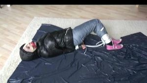 03:10 Min. video with Nina tied and gagged in a shiny nylon down jacket and shiny nylon rainpants