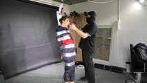 Marie taped and suspended in shiny nylon Rainwear