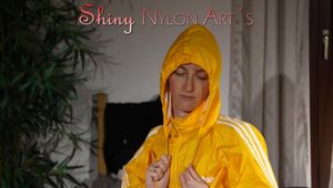 Sonja wearing a sexy blue shiny nylon shorts and a yellow rain jacket preparing her bed (Pics)