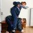 Leonie tied and gagged on a chest by Lia both wearing sexy shiny nylon rainwear (Pics)