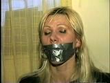 29 Yr OLD SEXY ROMANIAN IS FED A BANANA WHILE TIED TO A CHAIR, TAPE GAGGED & FREE HERSELF BY BITING HER RAWHIDE BONDS (D48-8)